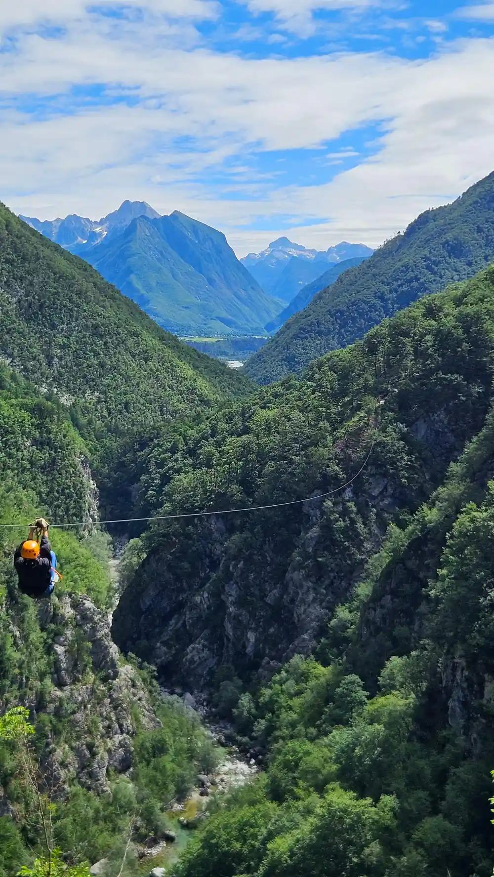 A rider crossing the gorge with the valley beyond
