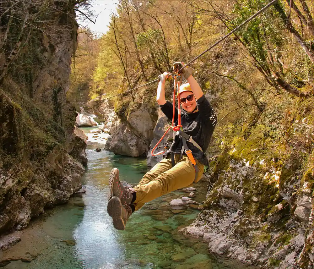 A rider above the green water of the gorge