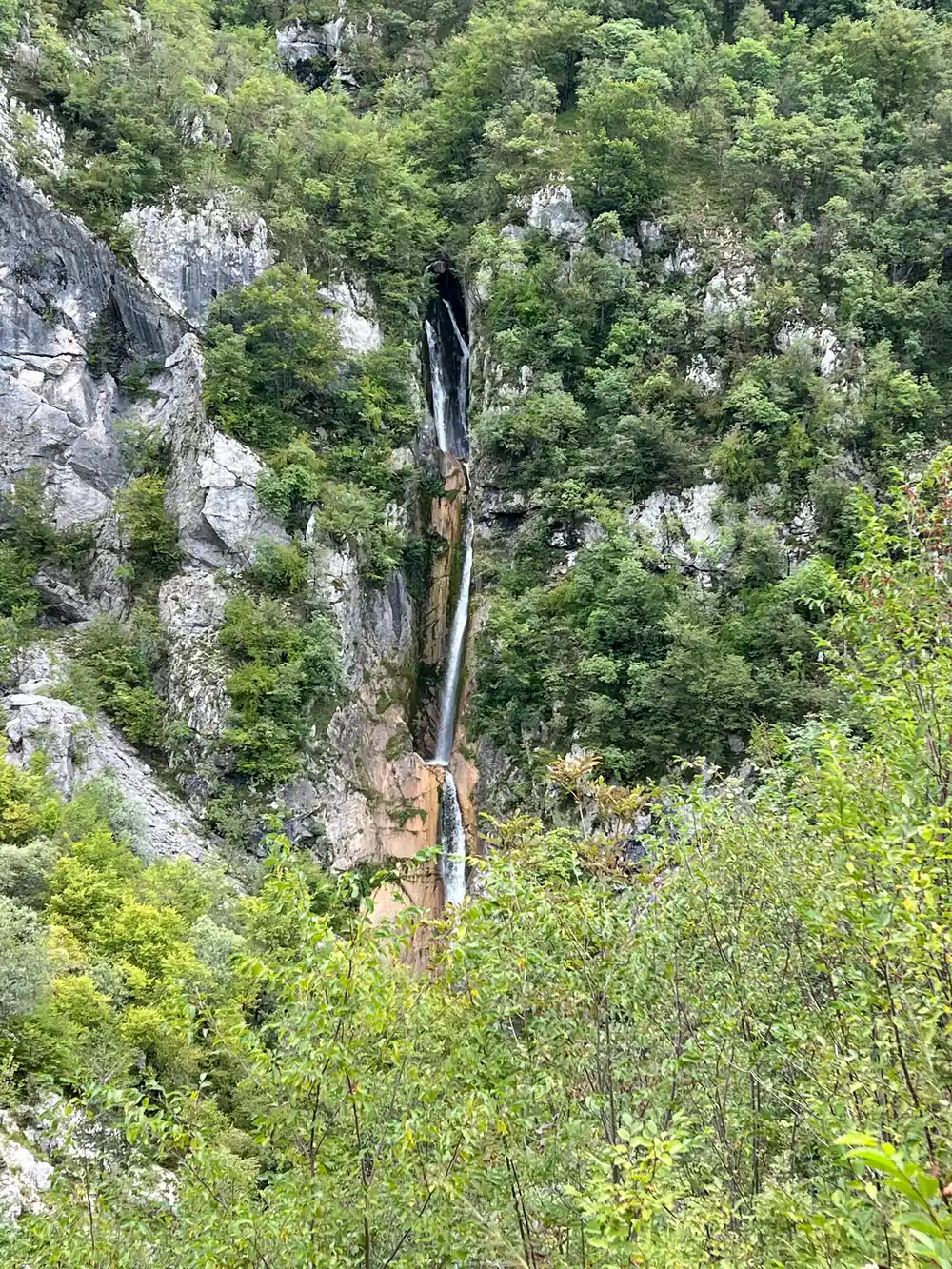 A thin waterfall on the canyon wall