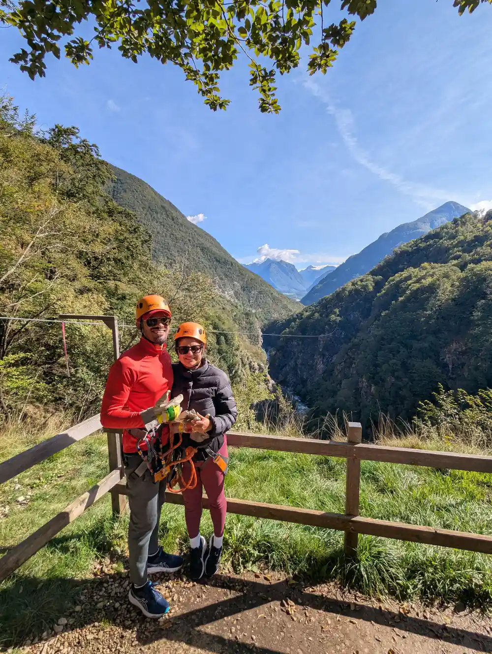 Two riders waiting at a rail above the gorge