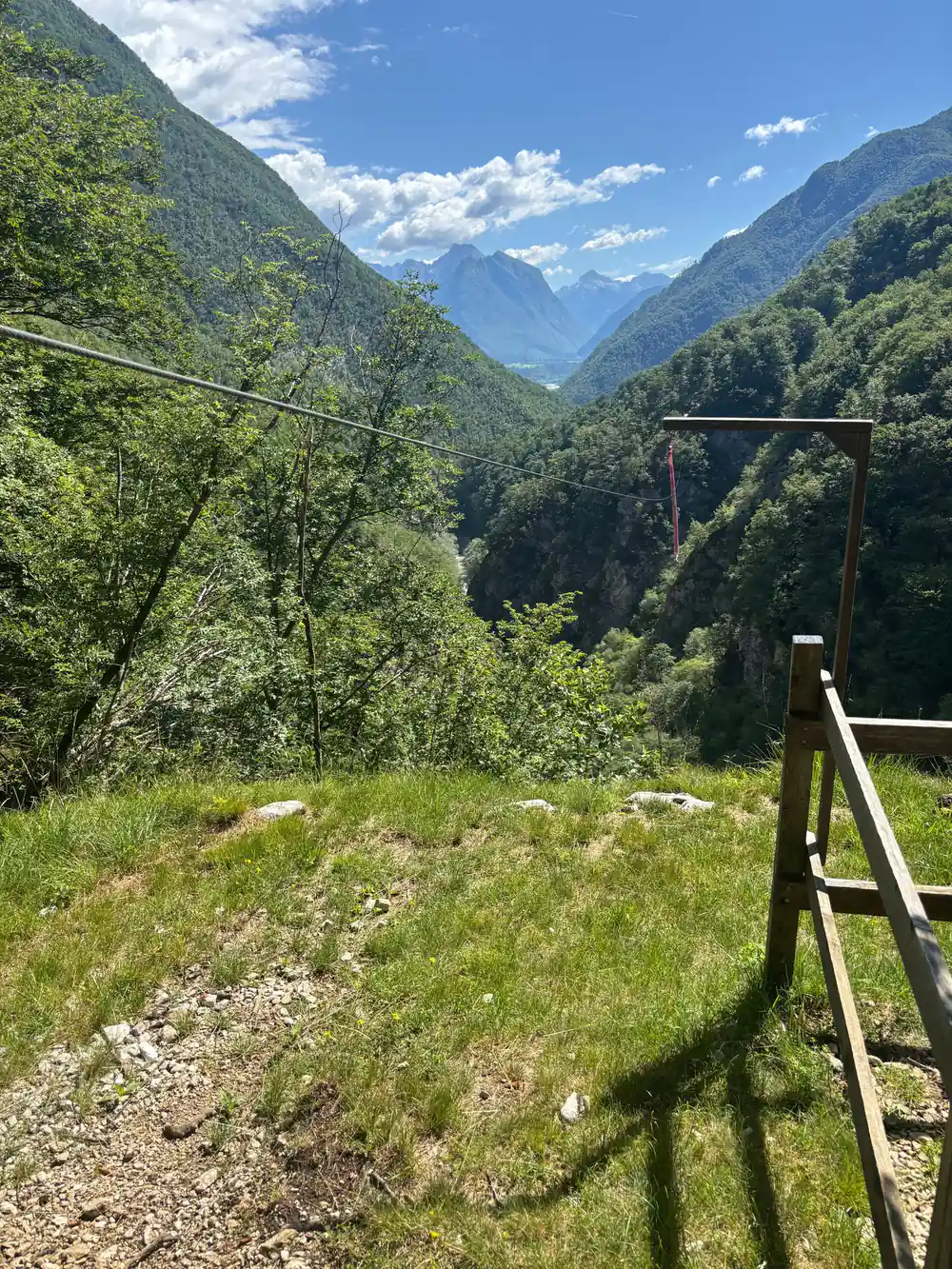 A wire and a platform on the meadow above the valley